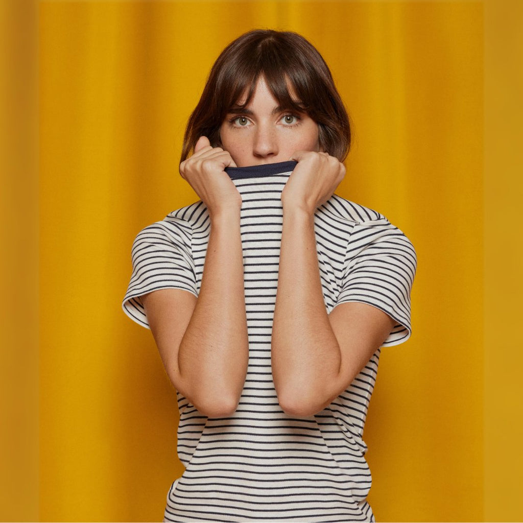 images of baby, girl, boy, and woman on a yellow curtain background